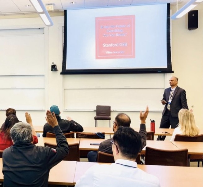 Vibhu Narwekar presenting AI and the Future of Everything to a full classroom at Stanford Graduate School of Business